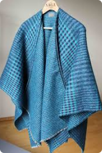 Blue patterned shawl on a hanger